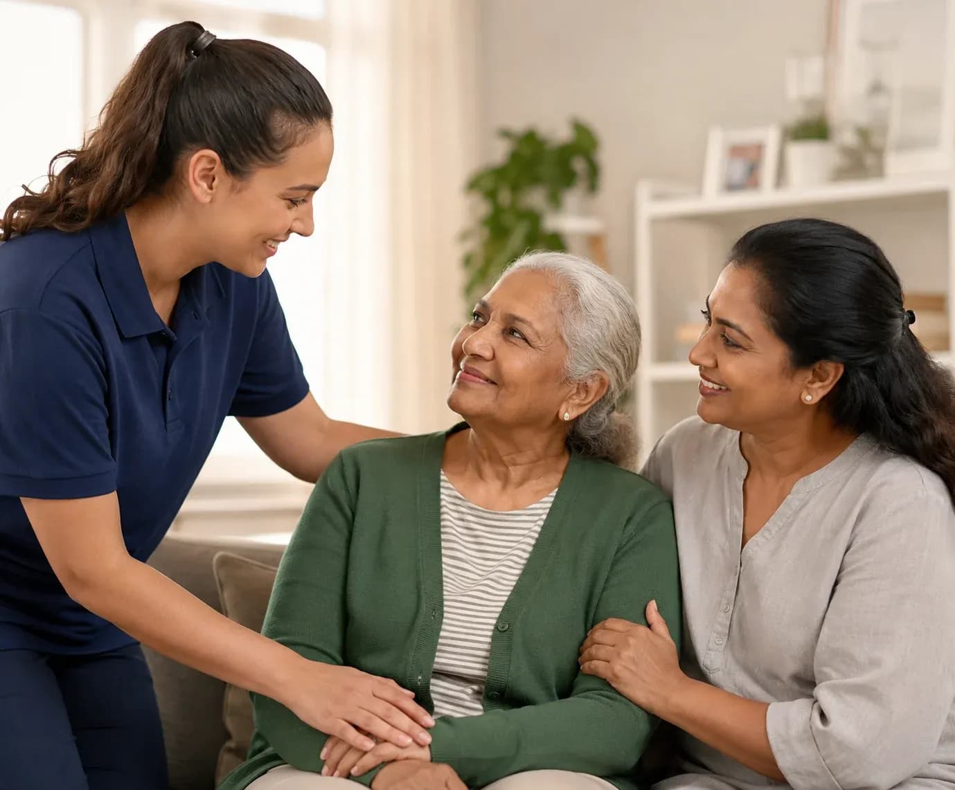 Compassionate in-home caregiver supporting an elderly client with a family member in a comfortable Australian home